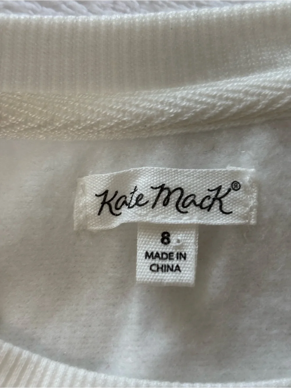 Kate Mack White Sweatshirt with Pink Macaron Stack